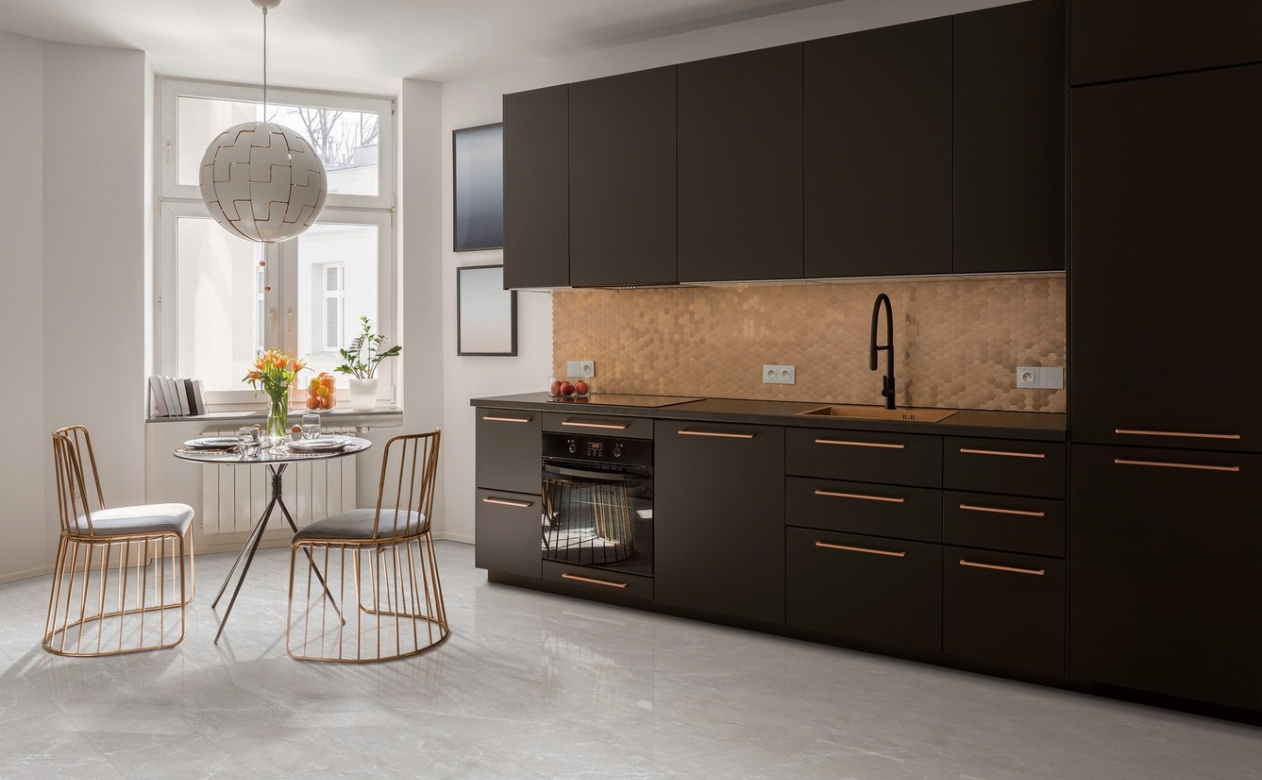 Kitchen with gray tile flooring and gold tile backsplash