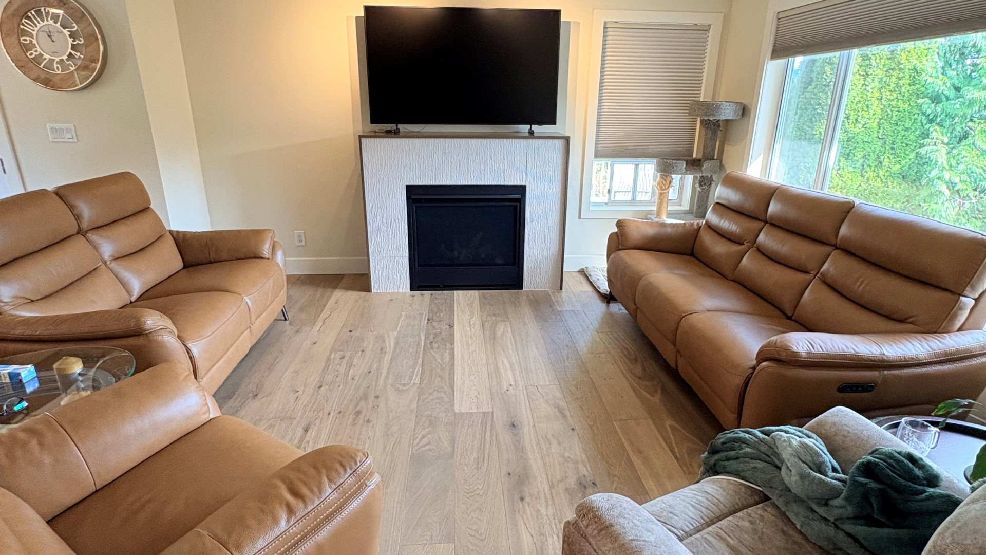 Wood-look vinyl flooring installation around fireplace in Fraser Valley BC home